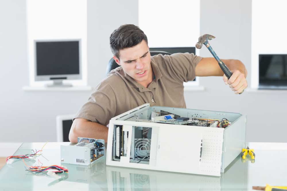 man-hitting-pc-with-hammer.jpg